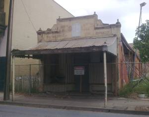 Roger Ray shared this photo of a derelict corner shop, boarded up and probably awaiting demolition 