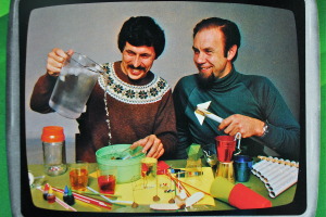 Photo from The Curiosity Show.  The programme  introduced  children to science, using do-it-yourself experiments with household items like matchsticks, rubber bands and cardboard.