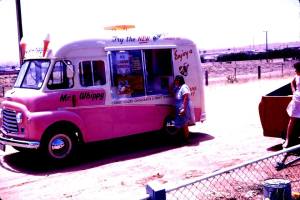 Photo courtesy of Mark Foy; "Here is a picture of My Mum at the Mr Whippy Van outside of our house in Pratt Avenue Pooraka in the very late 50's or very early 60's - It must have been summer and near Christmas looking at the advertising on the van. This before Pooraka was developed and was largely farms and paddocks"