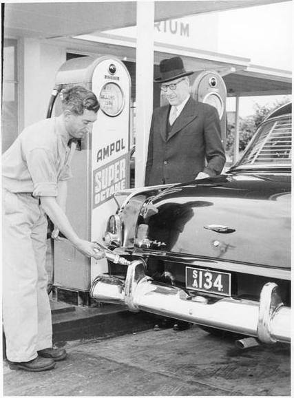 Photo from National Library of Australia; nla.pic-an 24679811-v.•The Lord Mayor of Adelaide, Mr. J.S. Philp, watches Frank Patten of the Beulah Park Ampol service station refuel his car during the Handicapped Children's Week Appeal, South Australia, December, 1955 [picture]  