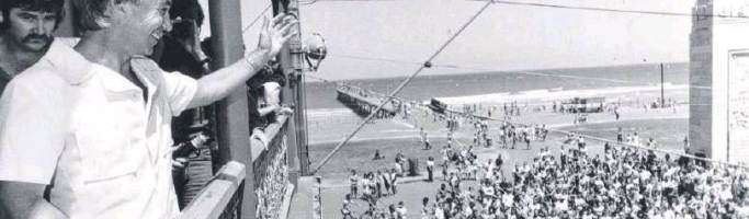 Adelaide’s Tidal Wave. The One That Never Happened Don Dunstan waves from the Pier Hotel balcony to the big crowd waiting on Glenelg beach for the predicted tidal wave