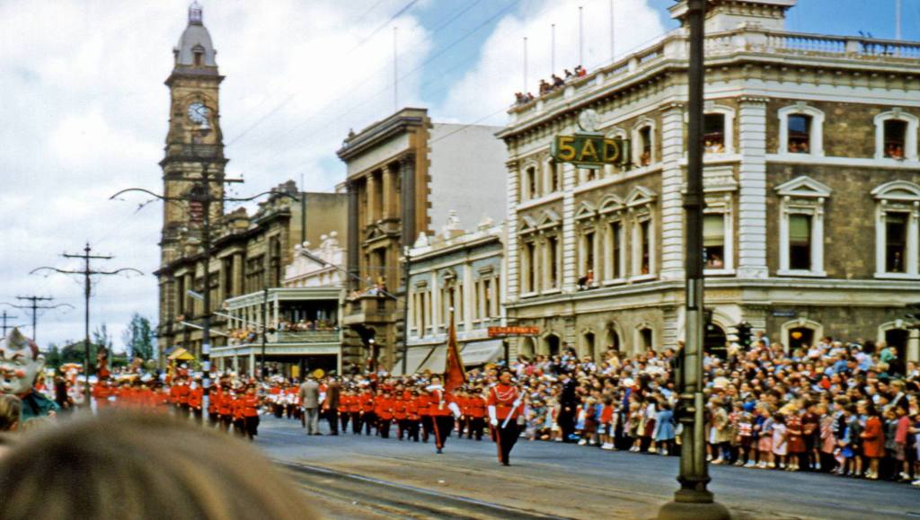 Photo courtesy of Ken Taylor. Johnnies 1957 pageant marches past the old 5AD building in King William Street