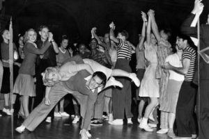 Teenagers jiving to rock'n'roll music in the 1950s 