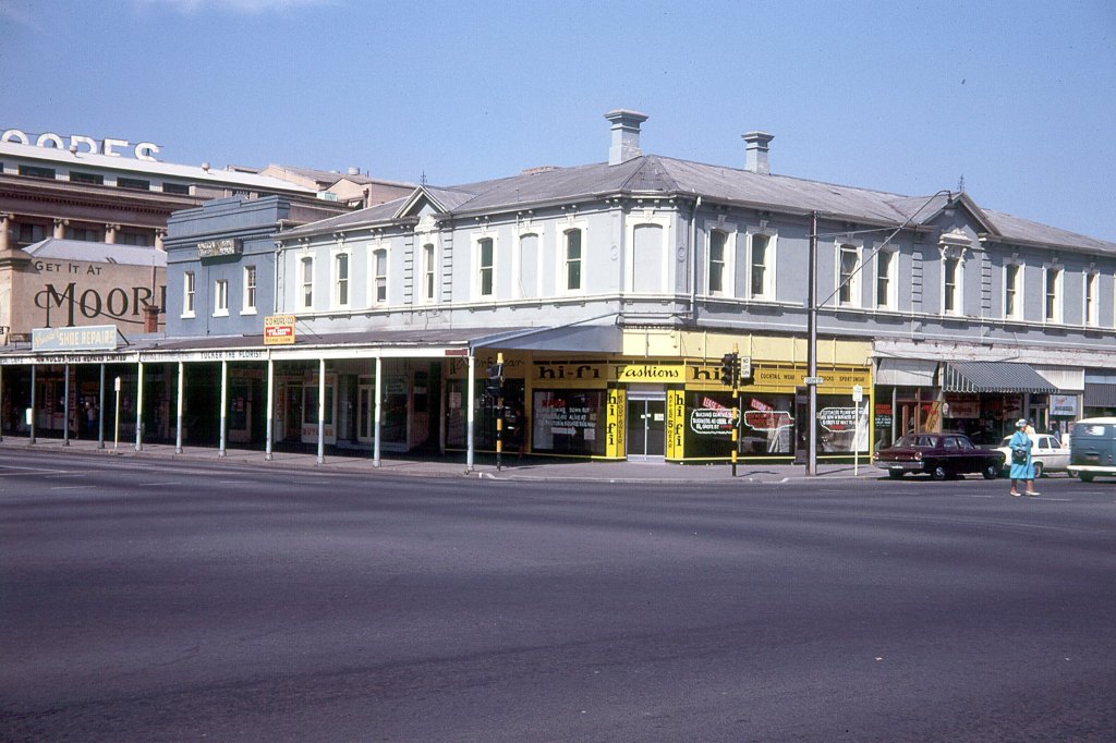 Photo by Frank Hall, Courtesy of Elaine Hall. Many of the photos in this book are from private photo collections.  This is Victoria Square where the Hilton International Hotel now stands, with Hi-Fi Fashions on the corner, and with Moores Department store in the background