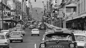 Photo 1964 of Hindley Street, with the Metro and Wests picture theatres, Miller Andersons and in the distance, the distinctive Cox Foys sign 