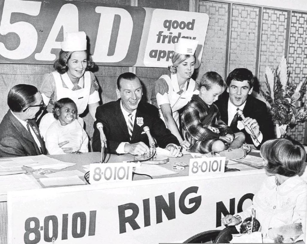 Photo from the Advertiser. The Good Friday Appeal 1967 was broadcast live from the Adelaide Children's Hospital. The panel includes 5AD Doghouse Club kennel masters, Len Sweeney, Bert Day and Barry Ion together with nurses Sue Macklin and Deanne Grundy