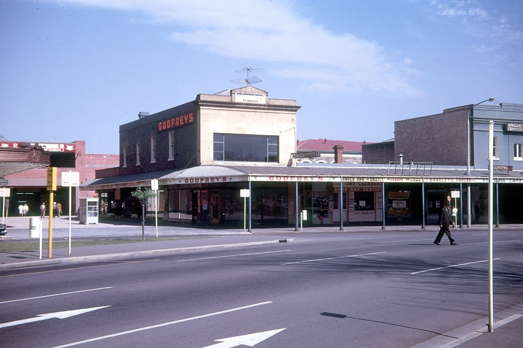 Before the Hilton Hotel was built. Some of the small shops that were on the site where the Hilton now stands in Victoria Square. 