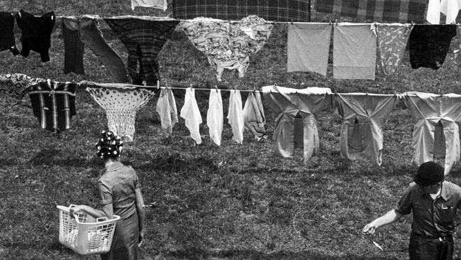 Clothes lines were strung up over the length of the backyard between two poles and could be adjusted for height at both ends. 