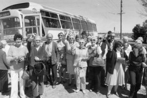 Off for a fun weekend. People about to board a bus to take them to a daytrip pokies tour to the Coomealla Memorial Club in Dareton, in 1983.
